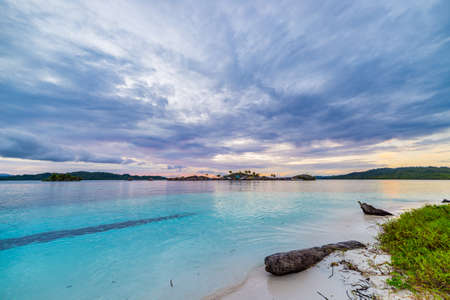 Tropical beach, caribbean sea, transparent turquoise water, remote Togean Islands (Togian Islands),...