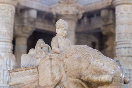Ranakpur, India - February 2, 2017: Interior of the majestic jainist temple at Ranakpur, Rajasthan, India. Architectural details of stone carvings, wide angle view.のeditorial素材
