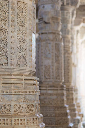 Ranakpur, India - February 2, 2017: Interior of the majestic jainist temple at Ranakpur, Rajasthan, India. Architectural details of stone carvings, wide angle view.のeditorial素材