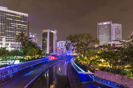 Kuala Lumpur, Malaysia - October 2, 2018: skyline night view blue lights on river in Kuala Lumpur,...