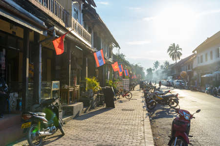 Luang Prabang, Laos - January 18, 2019: morning time in the main street of Luang Parabang, old heritage town in Laos, famous travel destinationのeditorial素材