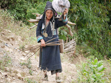 Phongsaly, Laos - november 2, 2019: portrait old woman wearing traditional turban belonging to minority ethnic group living in hilltribe villages around Muang Sing, North Laos.のeditorial素材