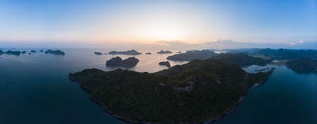 Aerial view of Ha Long Bay Cat Ba island, unique limestone rock islands and karst formation peaks in...