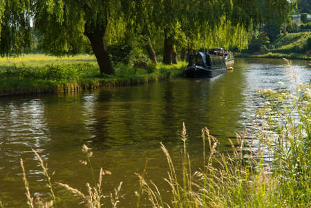 House boat on the river Wey in Guildford, Surrey, during a sunny spring day.の写真素材