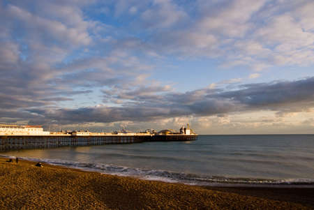 Brighton pier and coastline at sunset.