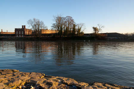 Hampton Court from the river Thames. Morning light.