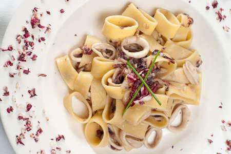 Pastai ai totani. Italian pasta with fish.の写真素材