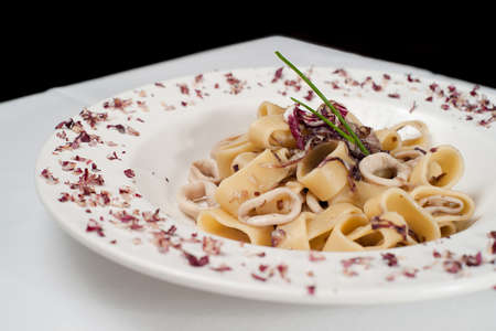 Pastai ai totani. Italian pasta with fish.の写真素材