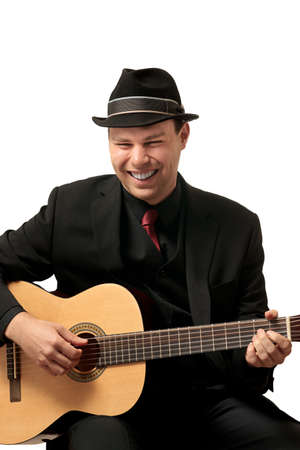 Attractive young man playing guitar  Headshot の写真素材