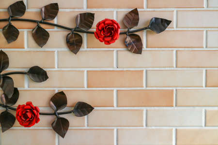 Brick wall with rose branches