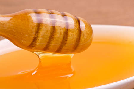 Honey and honey drizzlerの写真素材