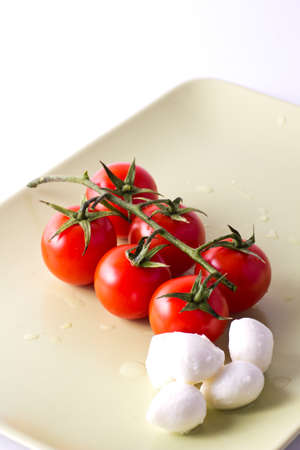 Bunch of fresh cherry tomatoes and mozzarellaの写真素材