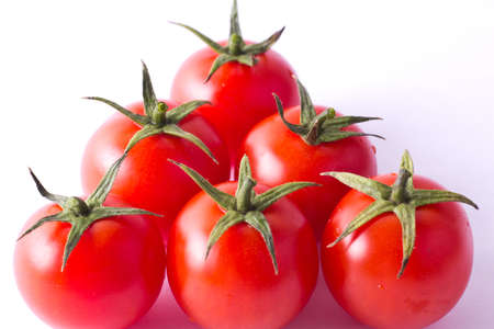 Cherry tomatoes isolated on whiteの写真素材