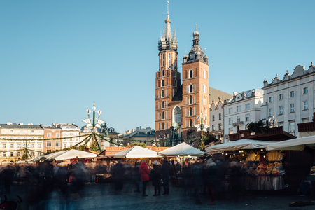 Krakow, Poland - December 30, 2017: Long exposure view of the Christmas market on Rynek Glowny, the main market square in the old town of Krakow, in the background the St Mary's basilica.のeditorial素材