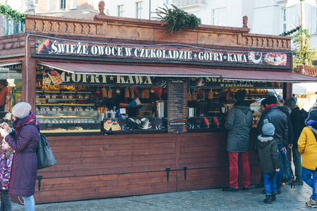 Krakow, Poland - December 30, 2017: Food kiosk at the Christmas market on Rynek Glowny, the main market square in the old town of Krakow.のeditorial素材