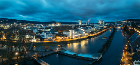 Aerial panoramic view of Zurich skyline at dawn, in the foreground the Limmat river.の写真素材