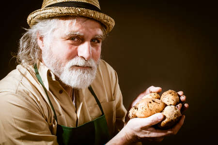 farmer shows his biological vegetables