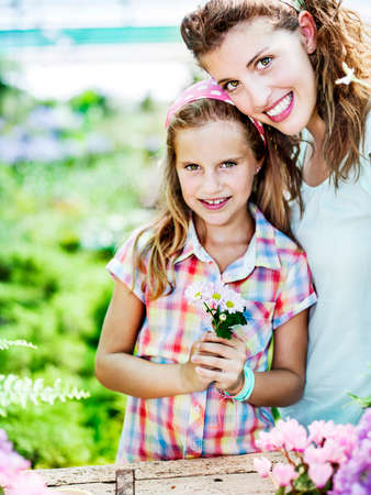 Mom and daughter have fun in the work of gardeningの写真素材