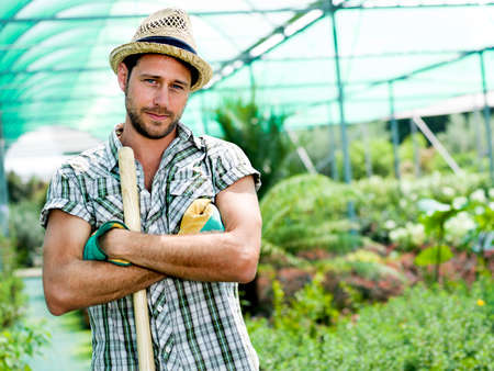 farmer at work in a greenhouseの写真素材