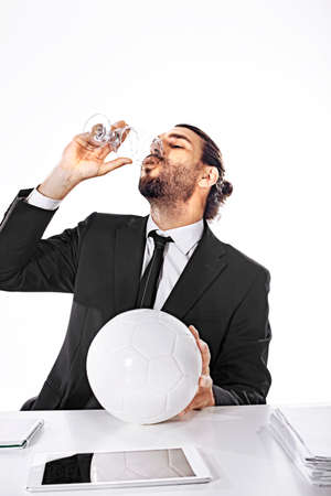 Alcholized business man celebrate football victoryの写真素材