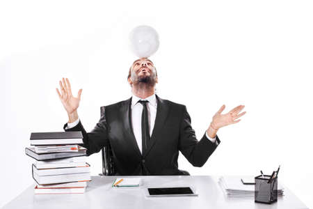 Business man working with soccer ball on his headの写真素材