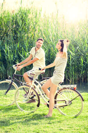 Couple having a bicycles ride into the natureの写真素材