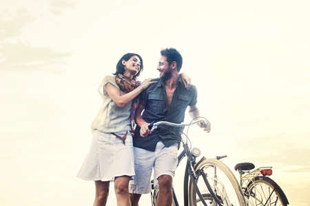 couple in love pushing bicycle togetherの写真素材