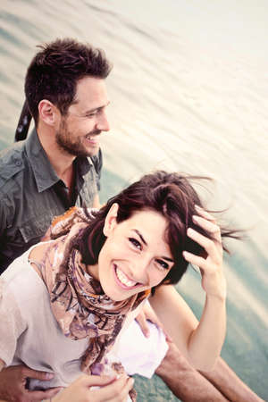 couple having fun on vacation at the lake in summerの写真素材
