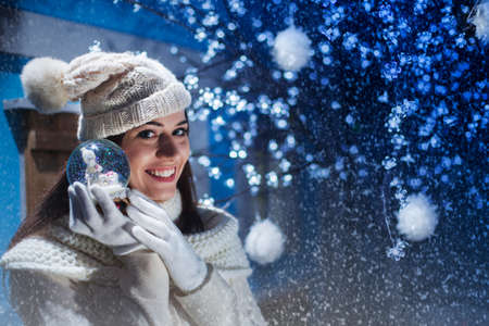 girl shows her gift snowballの写真素材