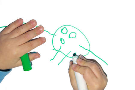 Hands of a child who drawの写真素材
