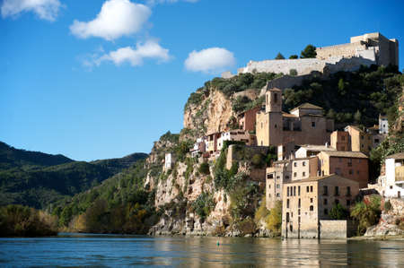 medieval village with castle used by Moors, Templars and Hospitaliers, and stone buildings on the banks of the river Ebro, Ribera de l Ebre  aka Ribera del Ebro , province of Tarragona, Catalonia, Spainのeditorial素材