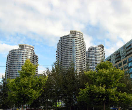 A city view from the park with buildings under the day skyの写真素材