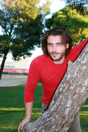 A handsome blonde young man portrait looking at the cameraの写真素材