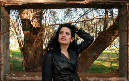 A brunette young beautiful woman with green eyes in a natural frame