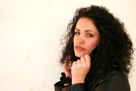 A brunette young beautiful woman with green eyes isolatedの写真素材