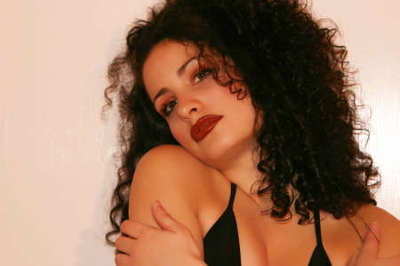 Beautiful young woman with warm red lipsの写真素材