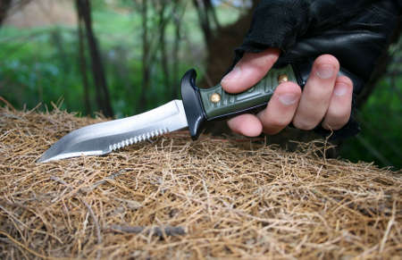 A big knife holded by a man's handの写真素材