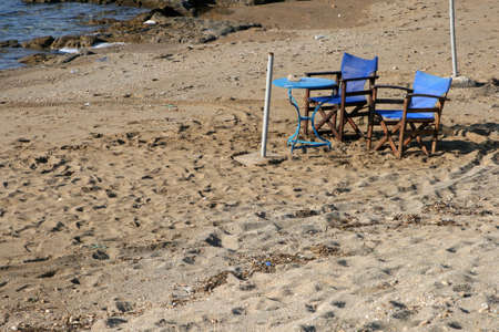 Chairs and table on the sandの写真素材