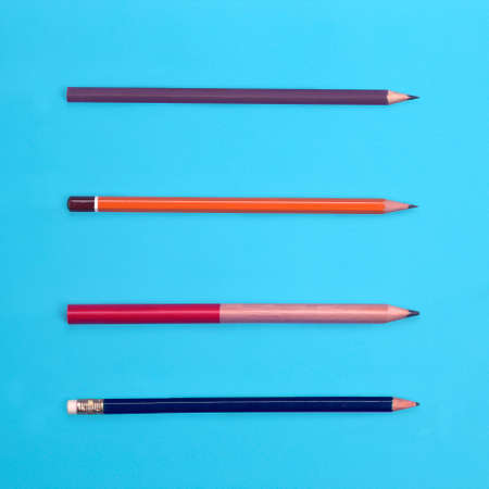 Set of various pencils view from above on colored backgroundの写真素材
