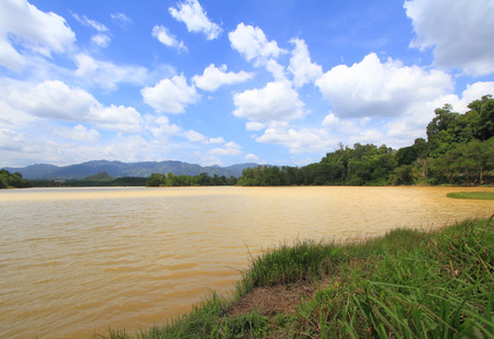 Blue sky and clouds over river in summer day. Lake landscapeの写真素材