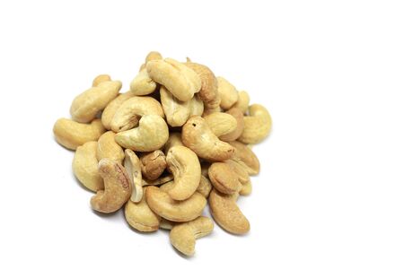Roasted and salted cashew nut over white backgroundの写真素材
