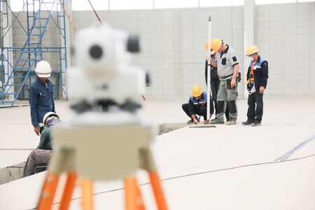 The engineers set survey structure foundation in industry.のeditorial素材
