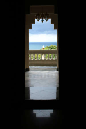 A shadow image is crisp images with the sea as background.の写真素材