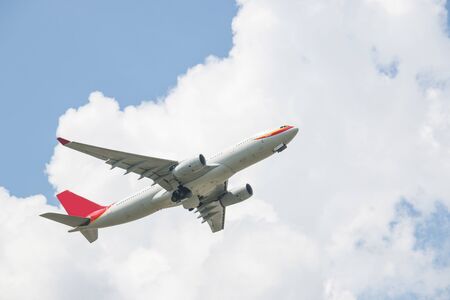 The plane was flying up the sky on a cloudy sky background.