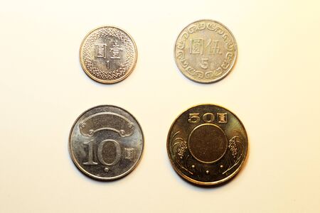 Coins of Taiwan Dollar white backgroundの写真素材