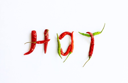 Fresh and dried chili peppers on a white backgroundの写真素材