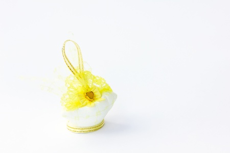 Traditional wedding souvenir with conch sculpture inside on white backgroundの写真素材