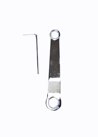 Hex key and ring spanner wrench on a white backgroundの写真素材