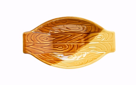 Brown sauce cup in boat-shaped cup on a white backgroundの写真素材