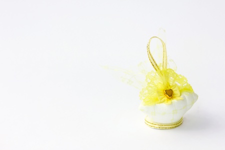 Traditional wedding souvenir with conch sculpture inside on white backgroundの写真素材